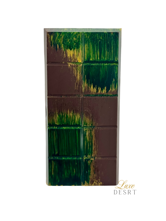 Dubai Chocolate Dark bar with Belgian dark chocolate, pistachio cream, caramelized kataifi, and tahini drizzle.